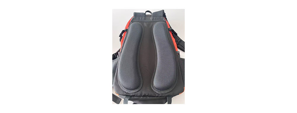 Backpack back panel with mesh fabric laminated over foam for breathability.